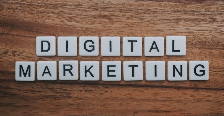 digital marketing artwork on brown wooden surface